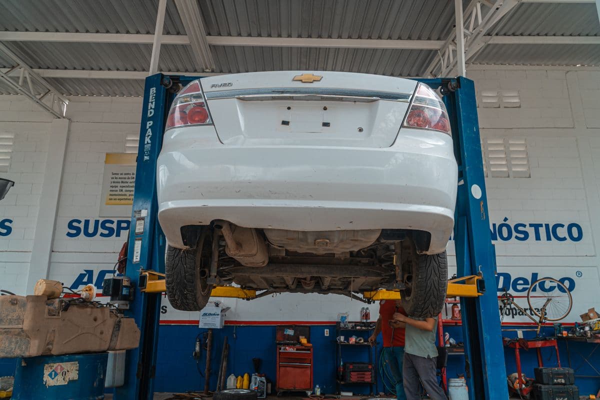 Vehicle raised on a lift in a diagnostic bay