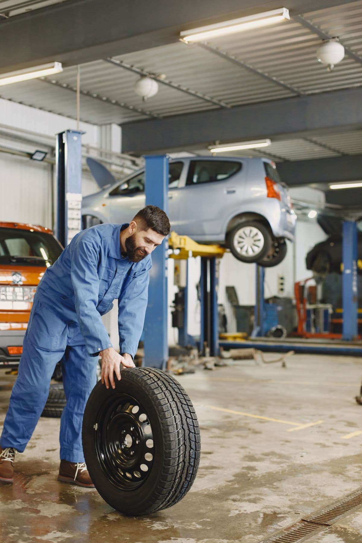 Repair shop with vehicles raised on lifts